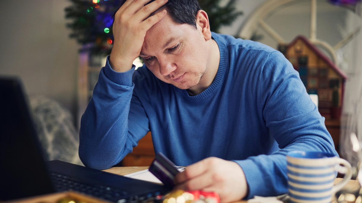 A man is frustrated to find out his gift card balance is empty.