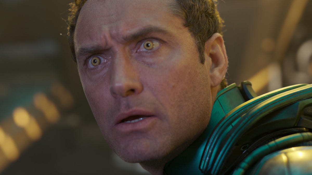 Jude Law as a space soldier stares in horror.