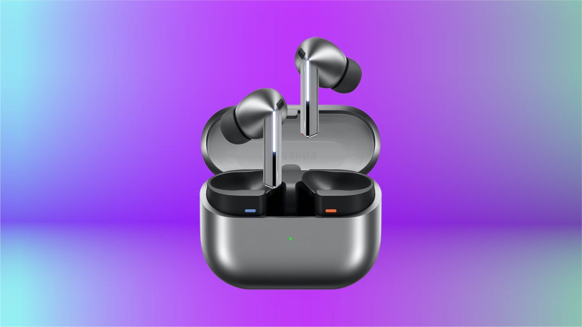 A pair of silvery gray Samsung earbuds with matching case on a purple background
