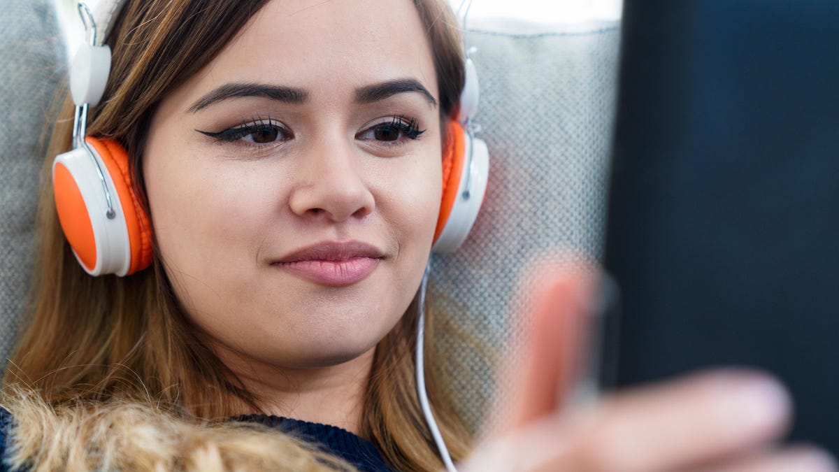 Young woman watching video on a tablet