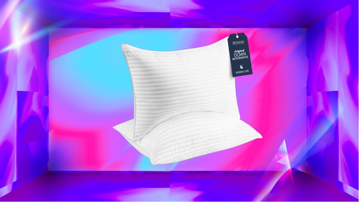 Two white Beckham Hotel Collection pillows with tags