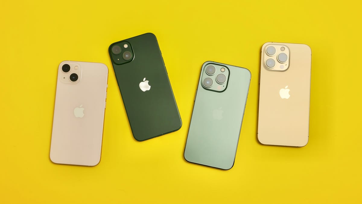 Four iPhones of different models and colors