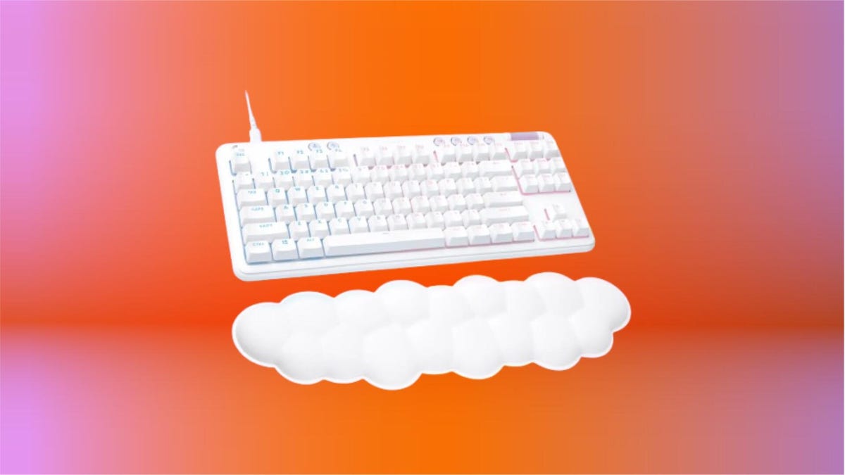 Logitech G713 wired gaming keyboard in white on orange background.