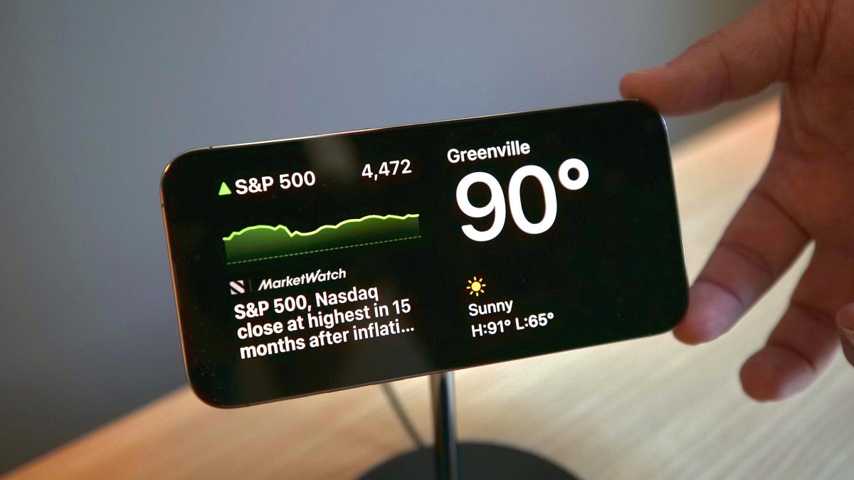 The iPhone on a MagSafe charger in StandBy mode