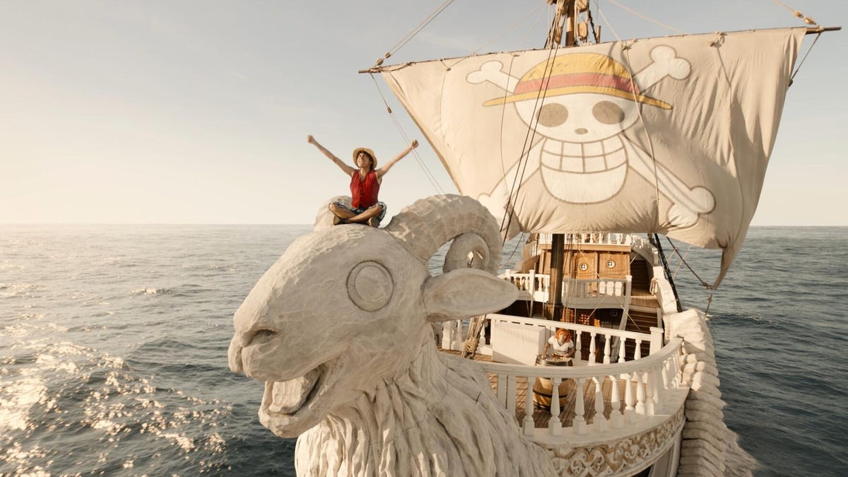 goat shaped pirate ship with man sitting on the figurehead