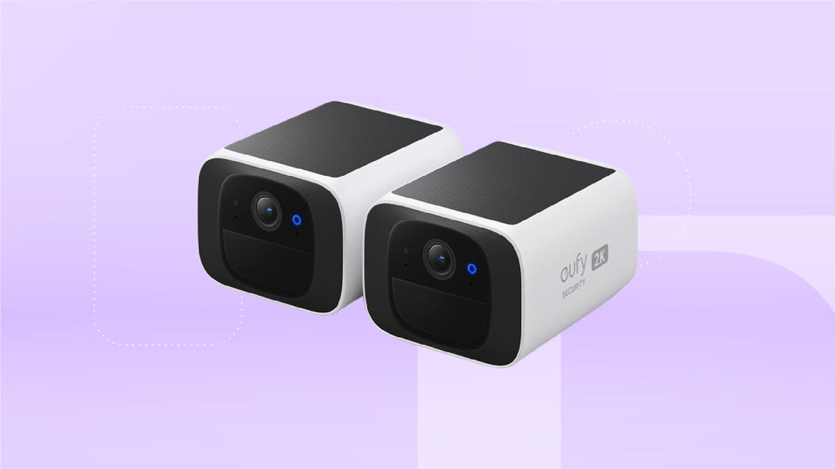 Two rectangular white and black security cameras set against a lilac background