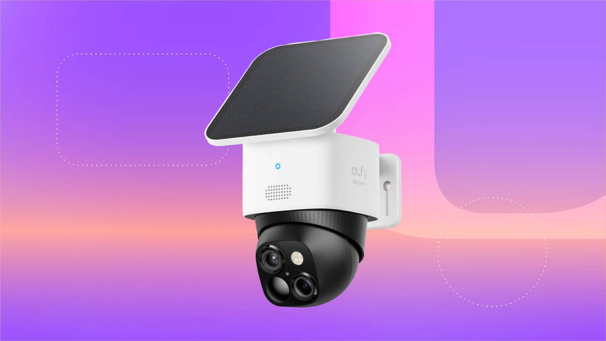 A white security camera against a purple gradient CNET background.