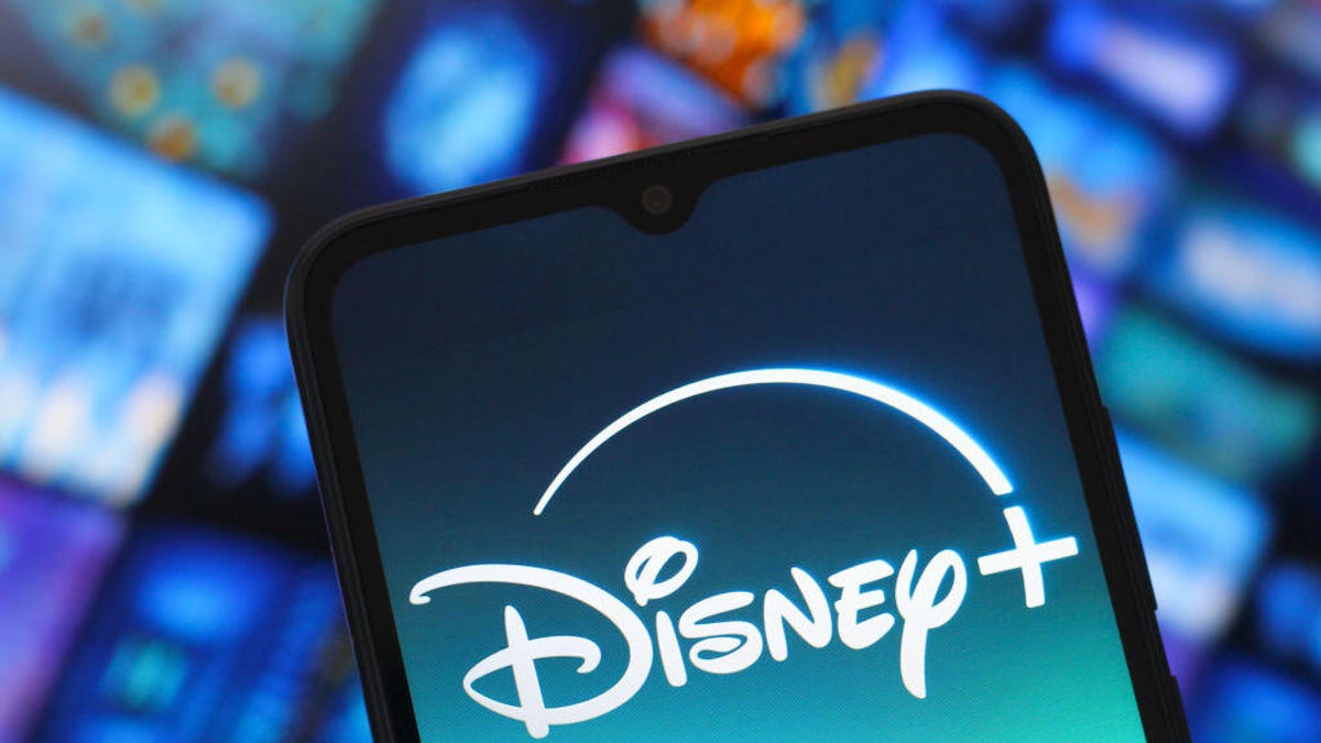 Disney Plus logo on a smartphone on blue background