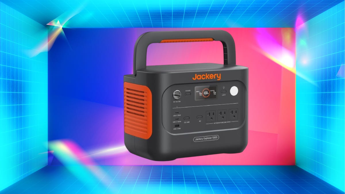 A black and orange power station against a yellow gradient CNET background.