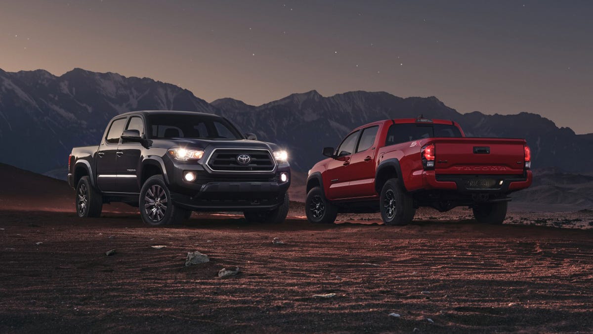 Two Toyota trucks parked facing opposite directions