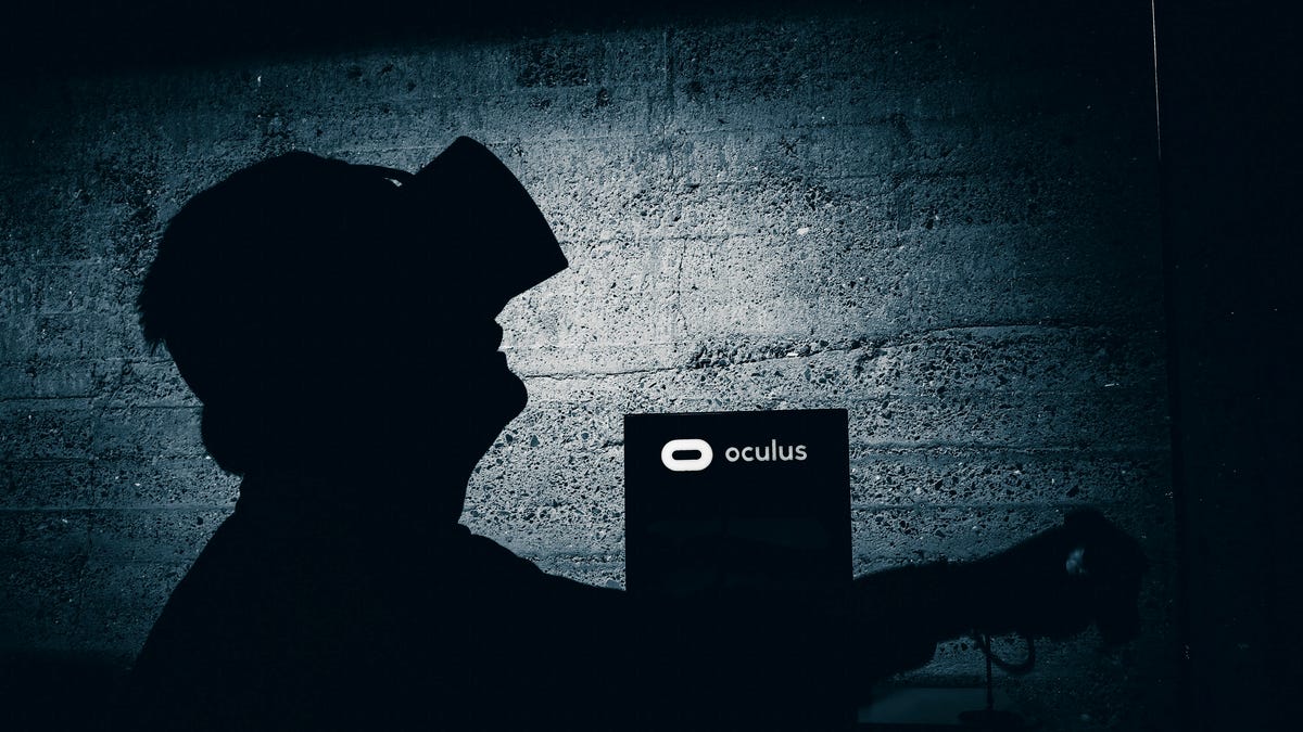A silhouette of a person in a VR headset