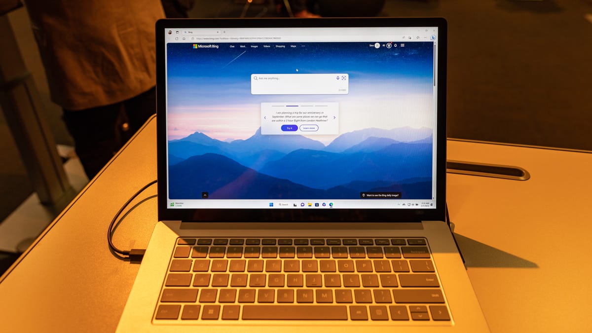 Microsoft demonstrates its AI-boosted Bing search engine on a laptop at a press conference
