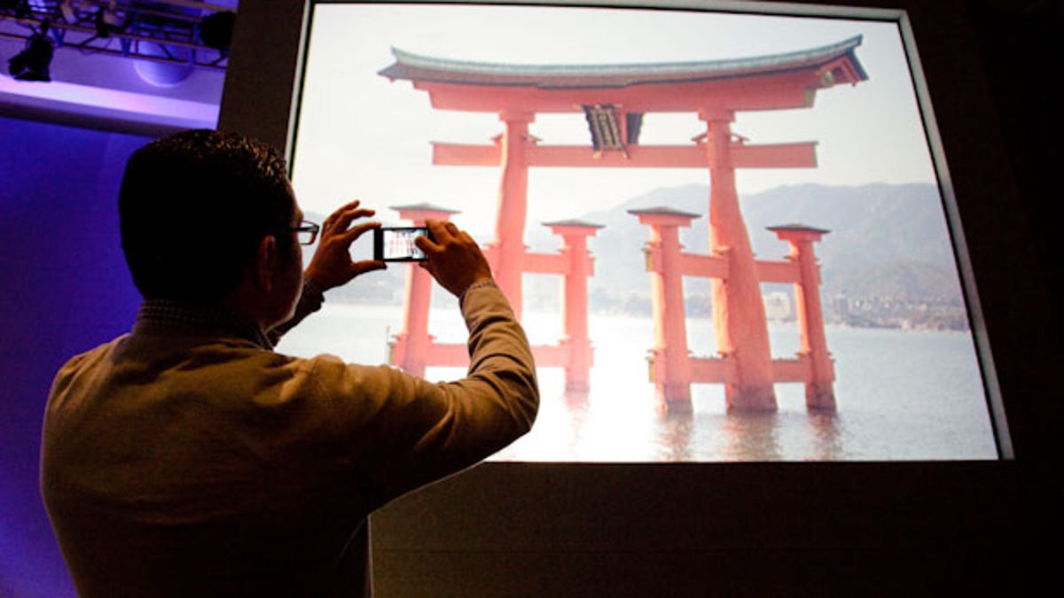 Vic Gundotra, Google's vice president of engineering, takes a photo of the Itsukushima Shrine in Japan. The Google Goggles feature successfully identified it.