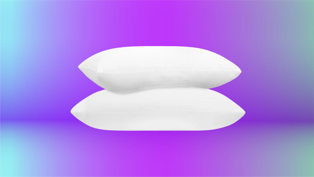 Two fluffy white pillows stacked on top of each other, set against a purple and blue background.