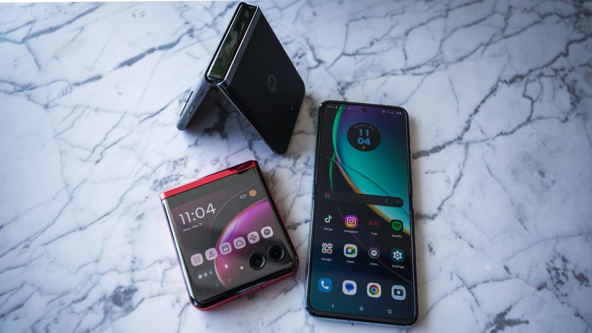 The Motorola Razr Plus (left) pictured next to the Motorola Razr 2023 (right)