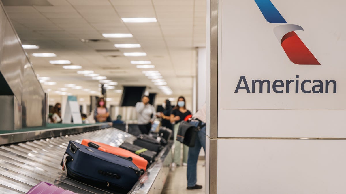 luggage on a carousel at American Airlines