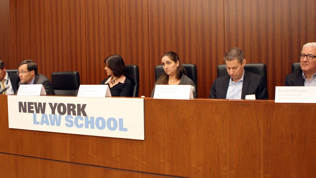 Link Hoewing, Verizon's vice president, and Fernando Laguarda, Time Warner Cable's vice president, on the left, say terminating customers isn't part of the deal.