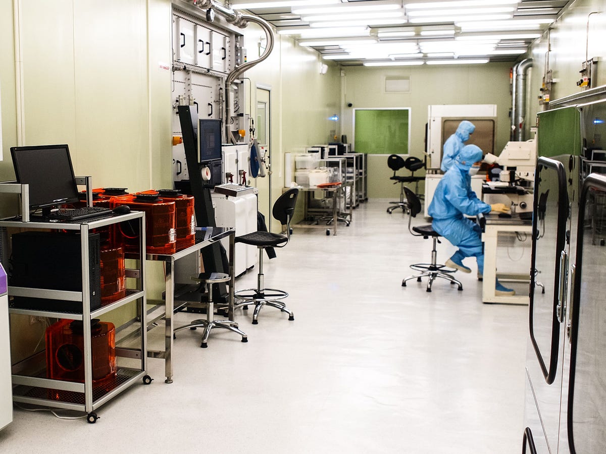 InVisage, based in Silicon Valley, adds a think layer of tiny particles called quantum dots to a circular wafer that will be sliced up into hundreds of rectangular image sensors. Here, staff work in an ultra-clean room to avoid contaminating the process. The quantum dots are sensitive to light -- more so than the silicon layer used in today's conventional digital camera technology.