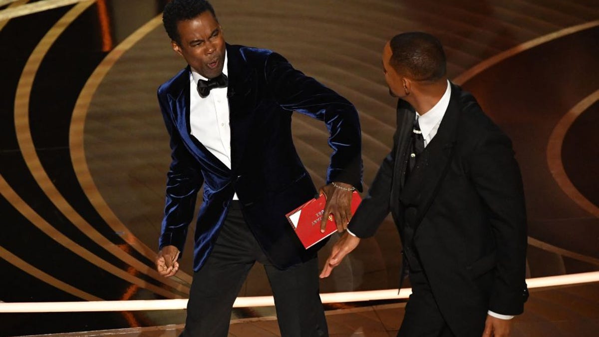 Will Smith slaps Chris Rock on stage at the 2022 Academy Awards