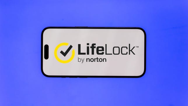 LifeLock logo appears on phone in front of royal blue background.