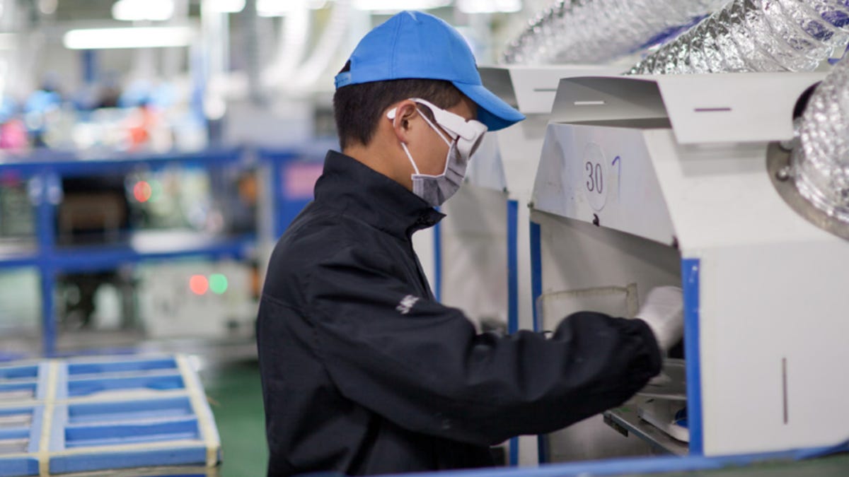 A worker in Chengdu, China helping to manufacture Apple's products.