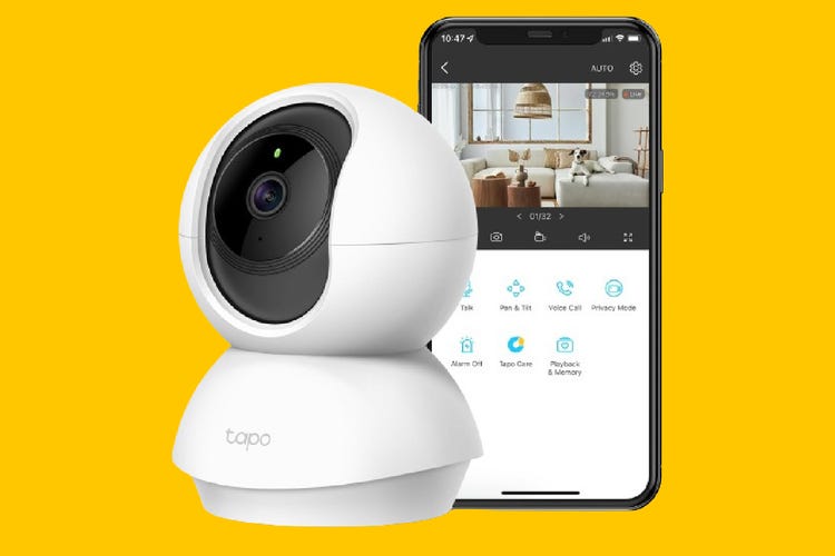The Tapo C210 indoor camera and smartphone with app against an orange background.