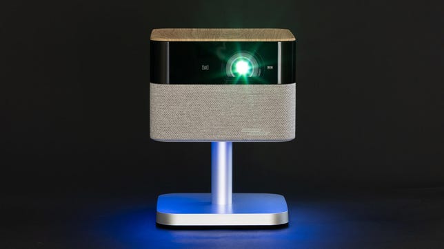 the front of the Epson Flex Plus projector, on a black background, with the lamp feature on