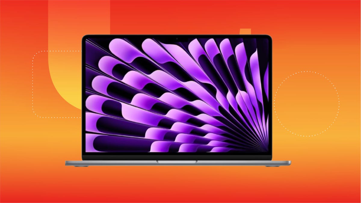 Apple MacBook Air M3 laptop with black and blue screensaver pattern displayed against a gradient green background