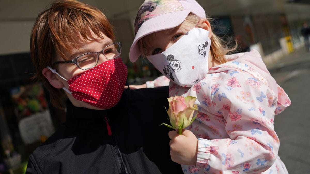 A mother and daughter in Berlin wear homemade face masks. The US Centers for Disease Control and Prevention now recommends that people in the states wear nonmedical, cloth face masks when they venture out.