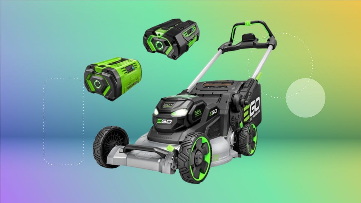 An electric lawn mower on display with two batteries against a gradient purple, green and yellow background