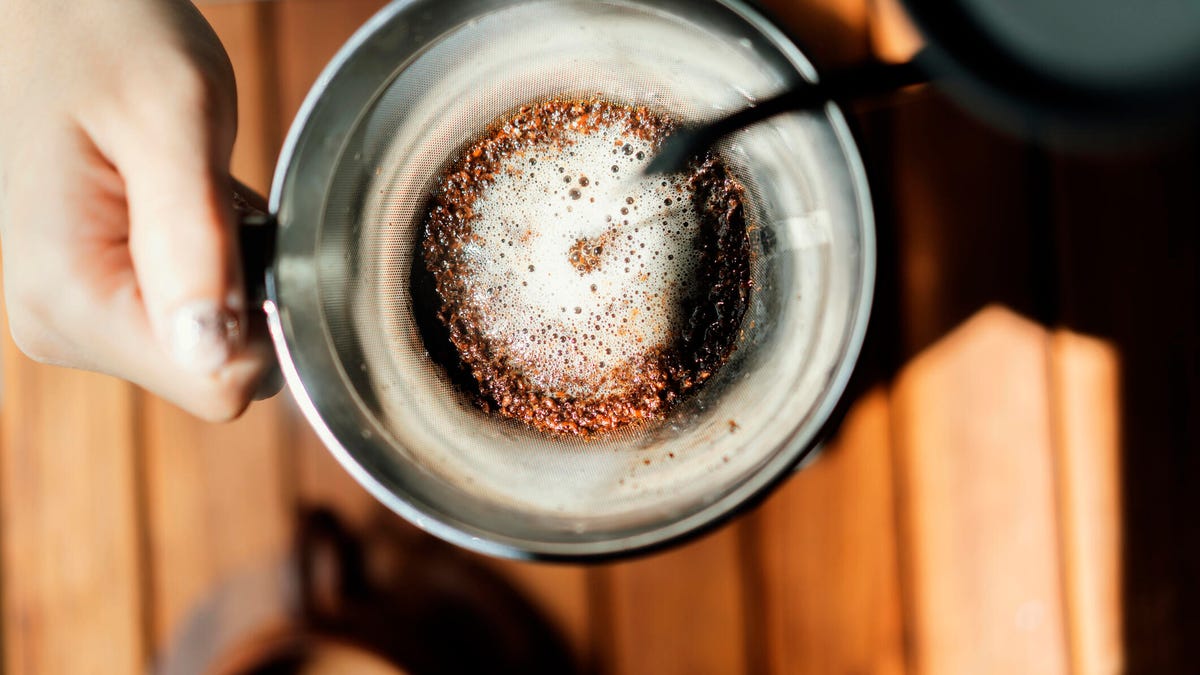 water being poured over coffee grounds