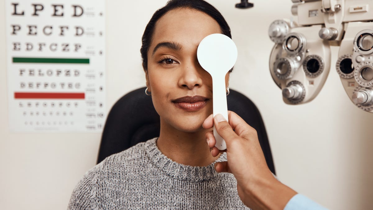 Woman getting an eye exam at the eye doctor