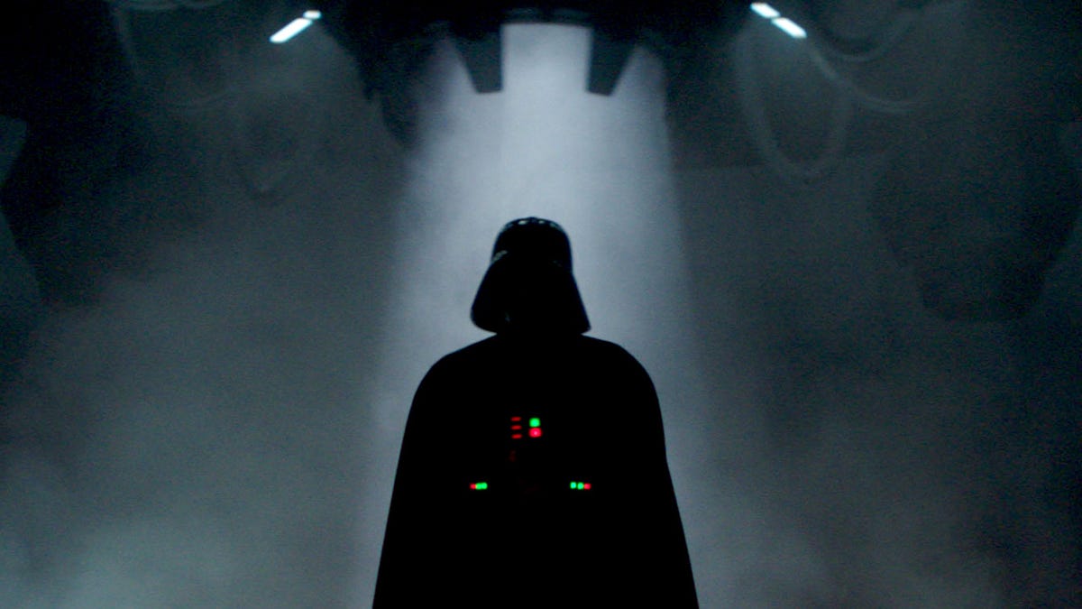 The unmistakeable silhouette of black-clad helmeted bad guy Darth Vader in Obi-Wan Kenobi on Disney Plus.