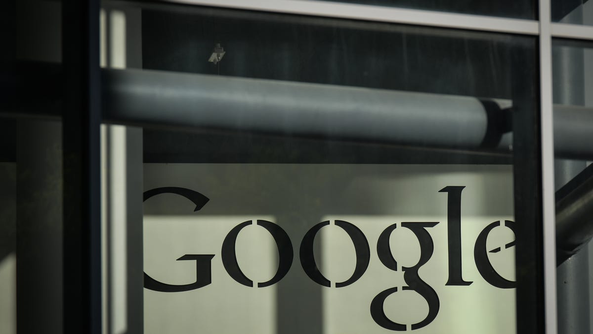 The Google logo in black text in a stencil font