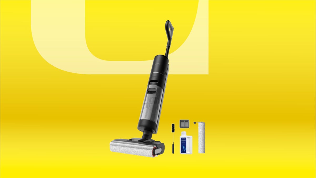 Black wet/dry cordless stick vacuum against yellow CNET background.