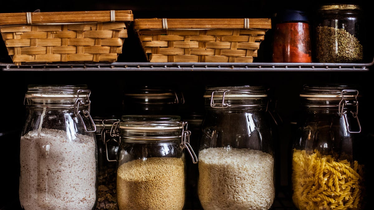 organized cabinet with food in jars