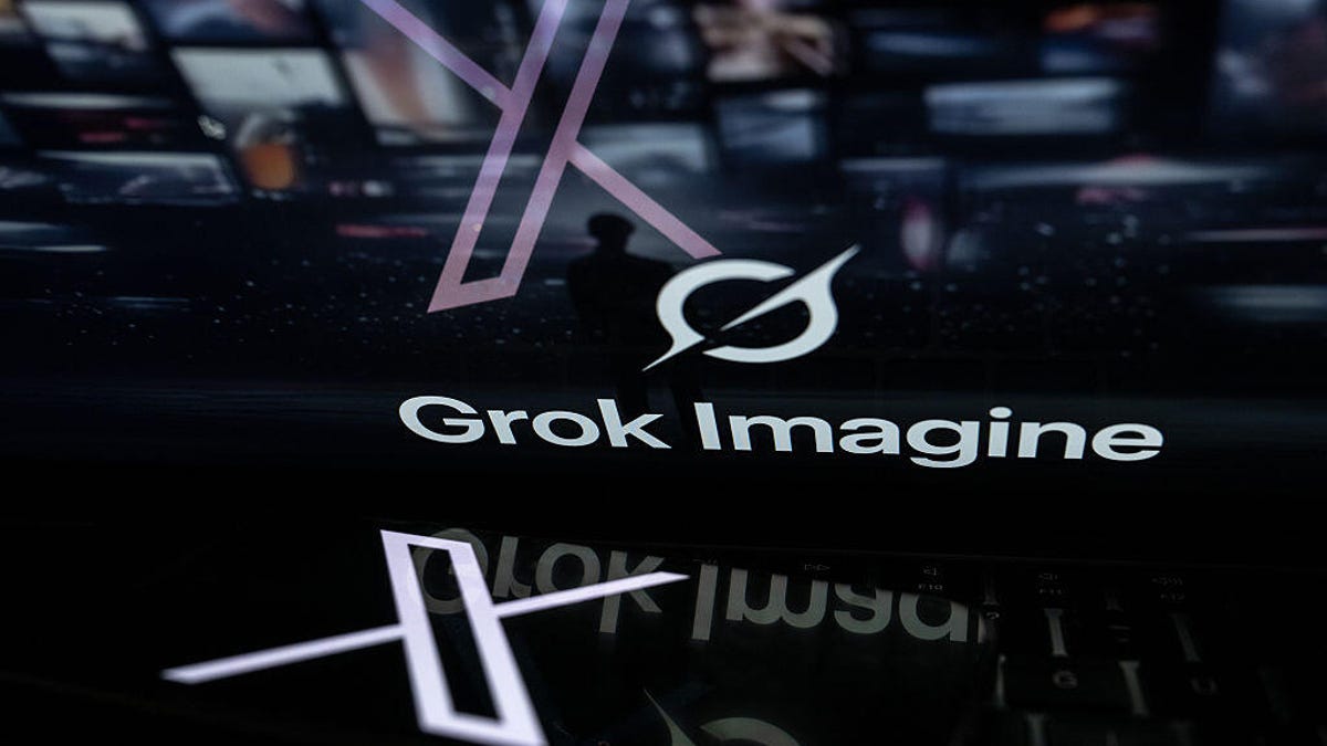 the logo of Grok is displayed on computer screen with the logo of X is displayed on phone screen on the front