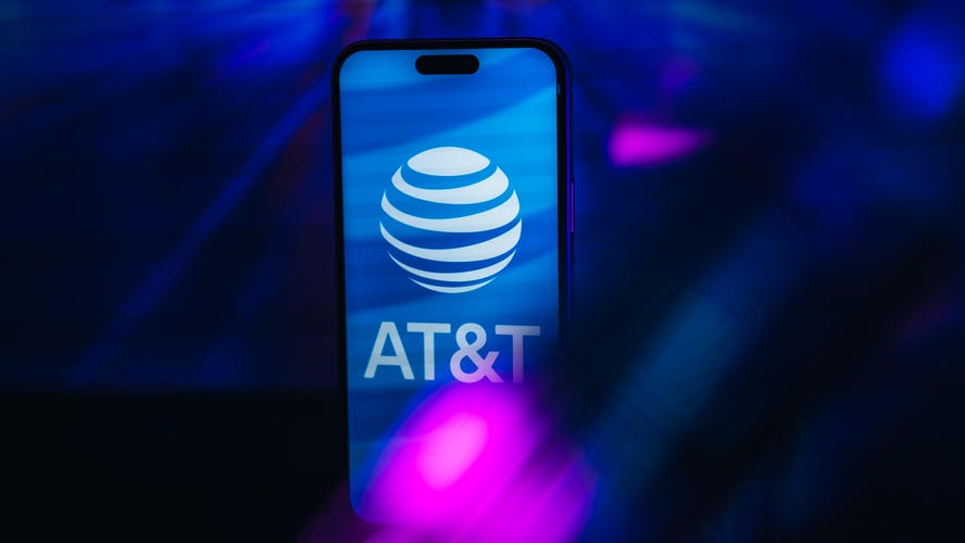 AT&T logo on iPhone screen against a blue backdrop