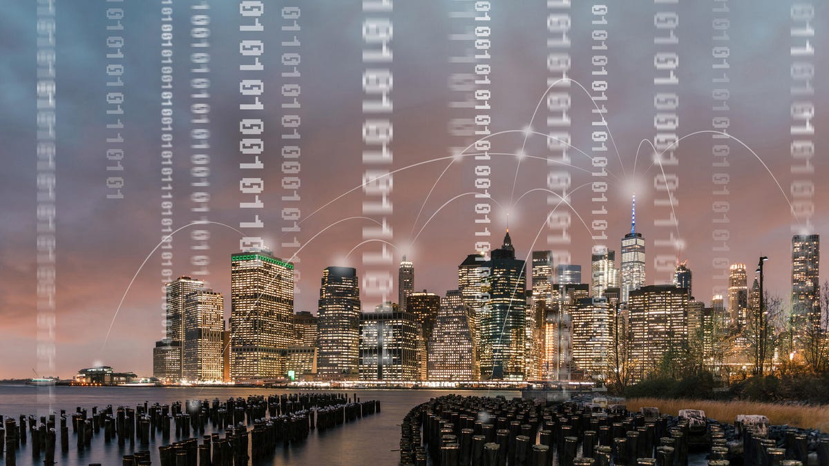 New York City skyline is shown with an overlay of binary code