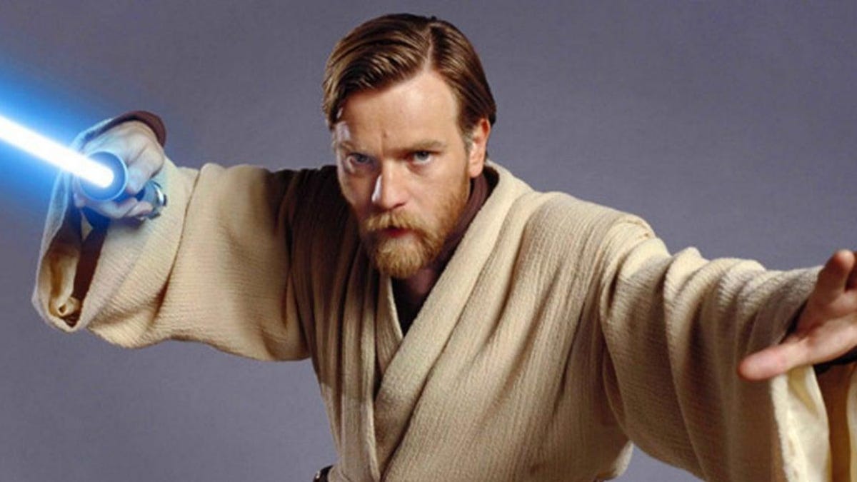 A bearded Ewan McGregor prepares to fight you with his glowing lightsaber.
