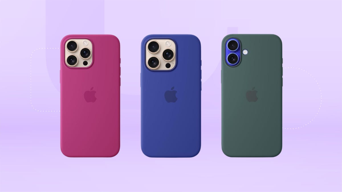 Two Apple iPhones on a multicolored background, one with a salmon colored case (left) and one with a white case