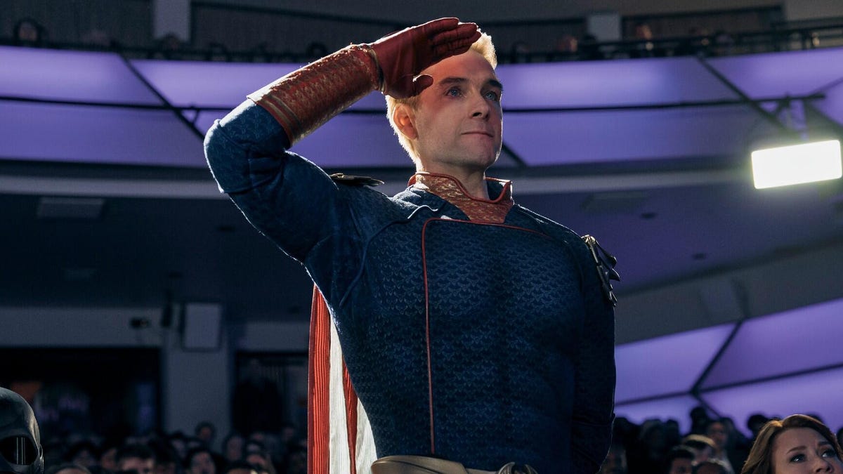 Image from The Boys showing Homelander in superhero suit standing and saluting.