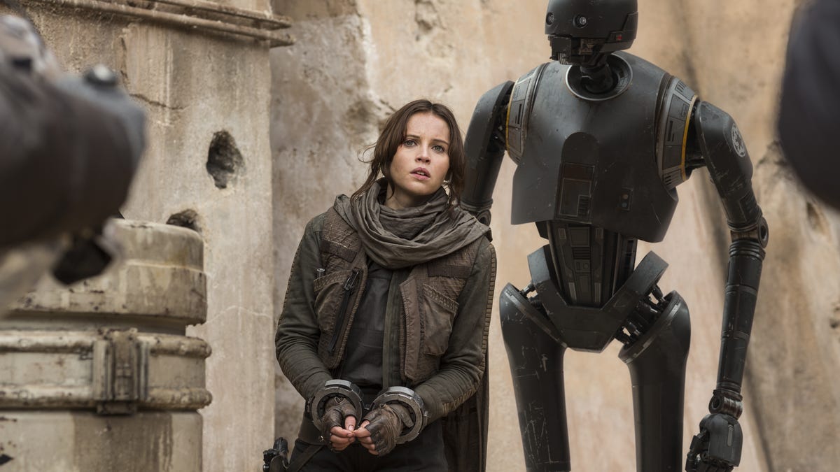 Felicity Jones as Jyn Erso in Rogue One, with robot companion K-2SO