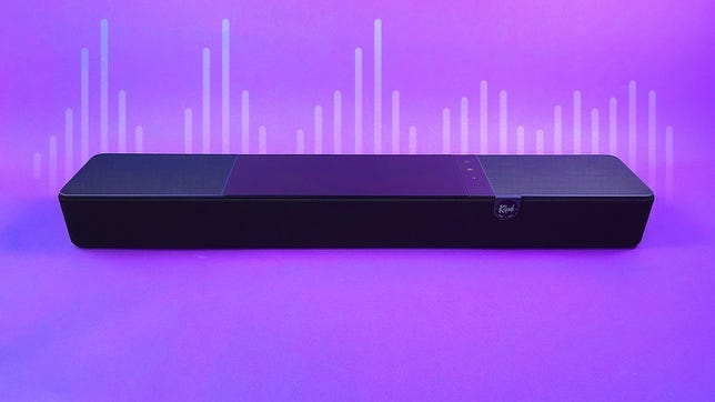 Klipsch sound bar speaker against a purple backdrop with soundwaves