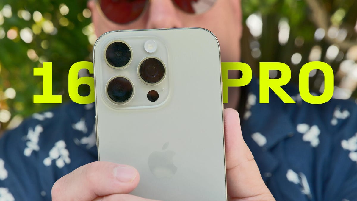 a man holding the iPhone 16 Pro