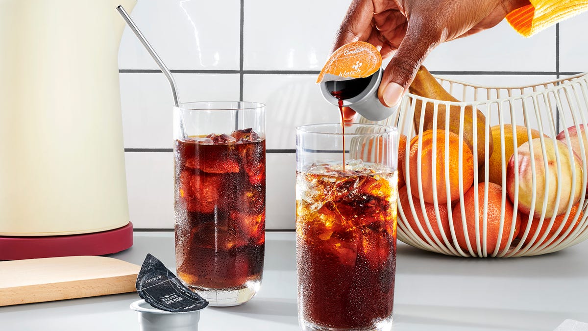 Coffee poured into a glass of ice.