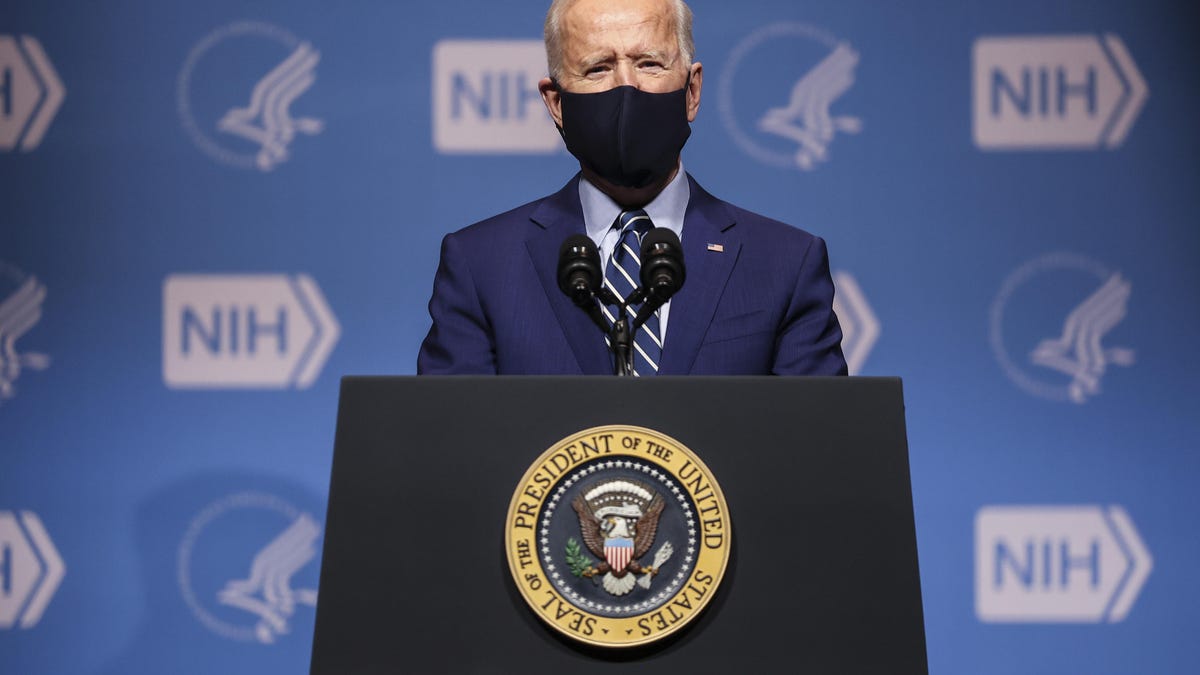 President Biden wears a mask while speaking at the National Institutes of Health