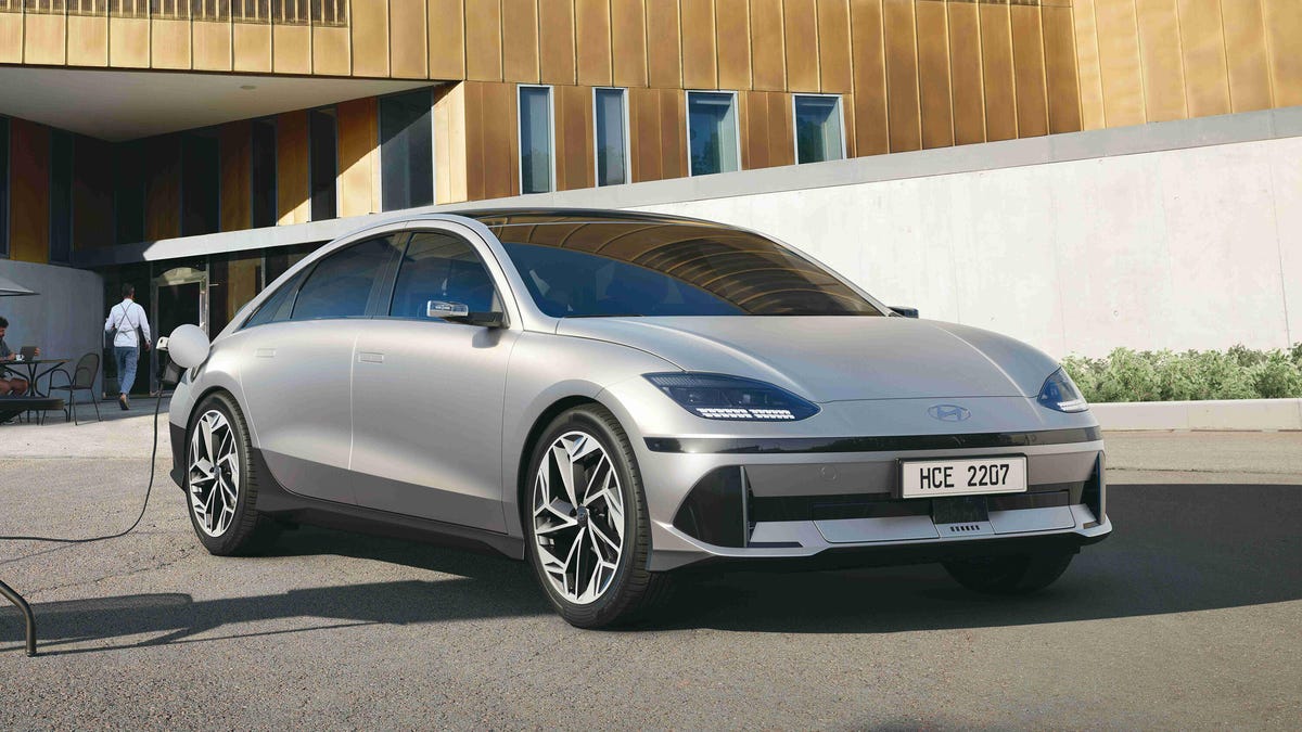 Front 3/4 view of a matte beige 2023 Hyundai Ioniq 6 EV