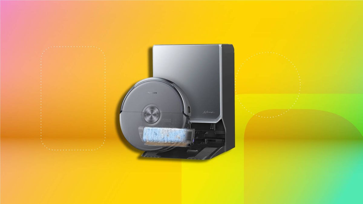 A Narwal Flow 2 robot vacuum and mop it its base with an orange and yellow CNET background