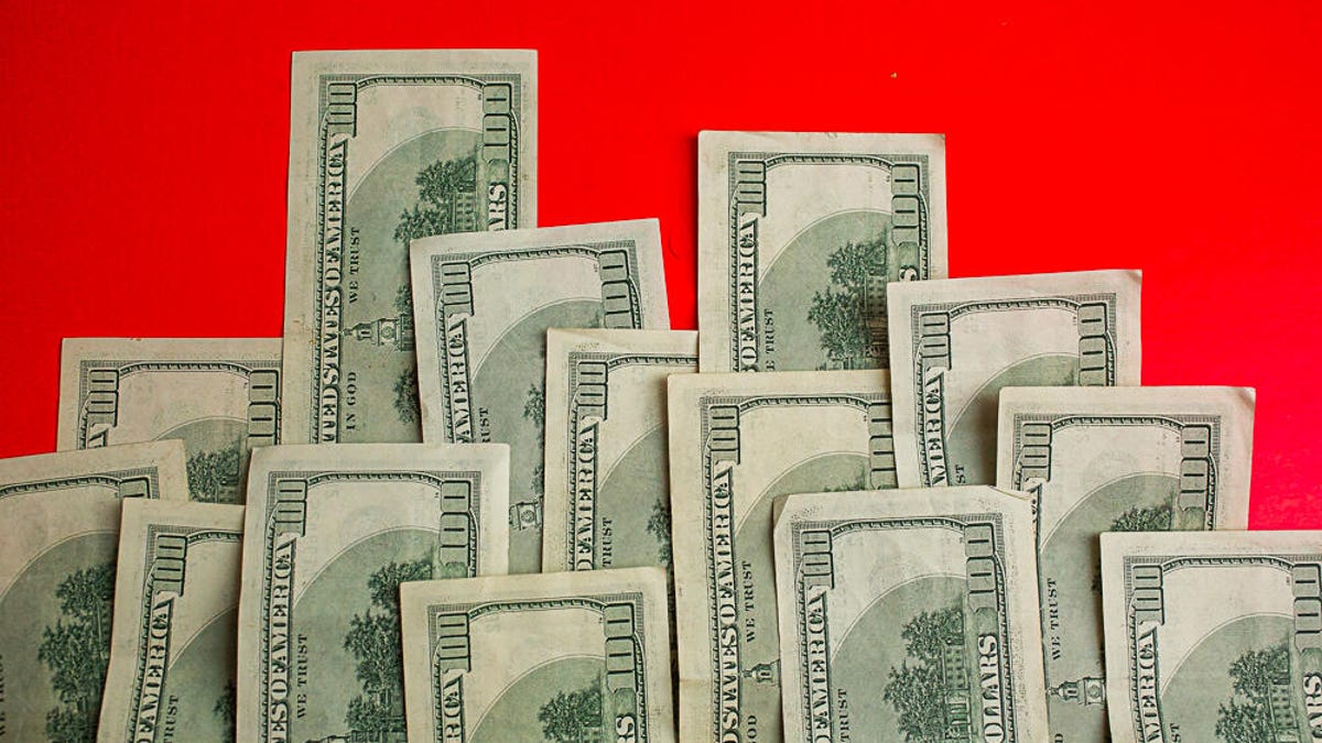 $100 bills in a staggered layout